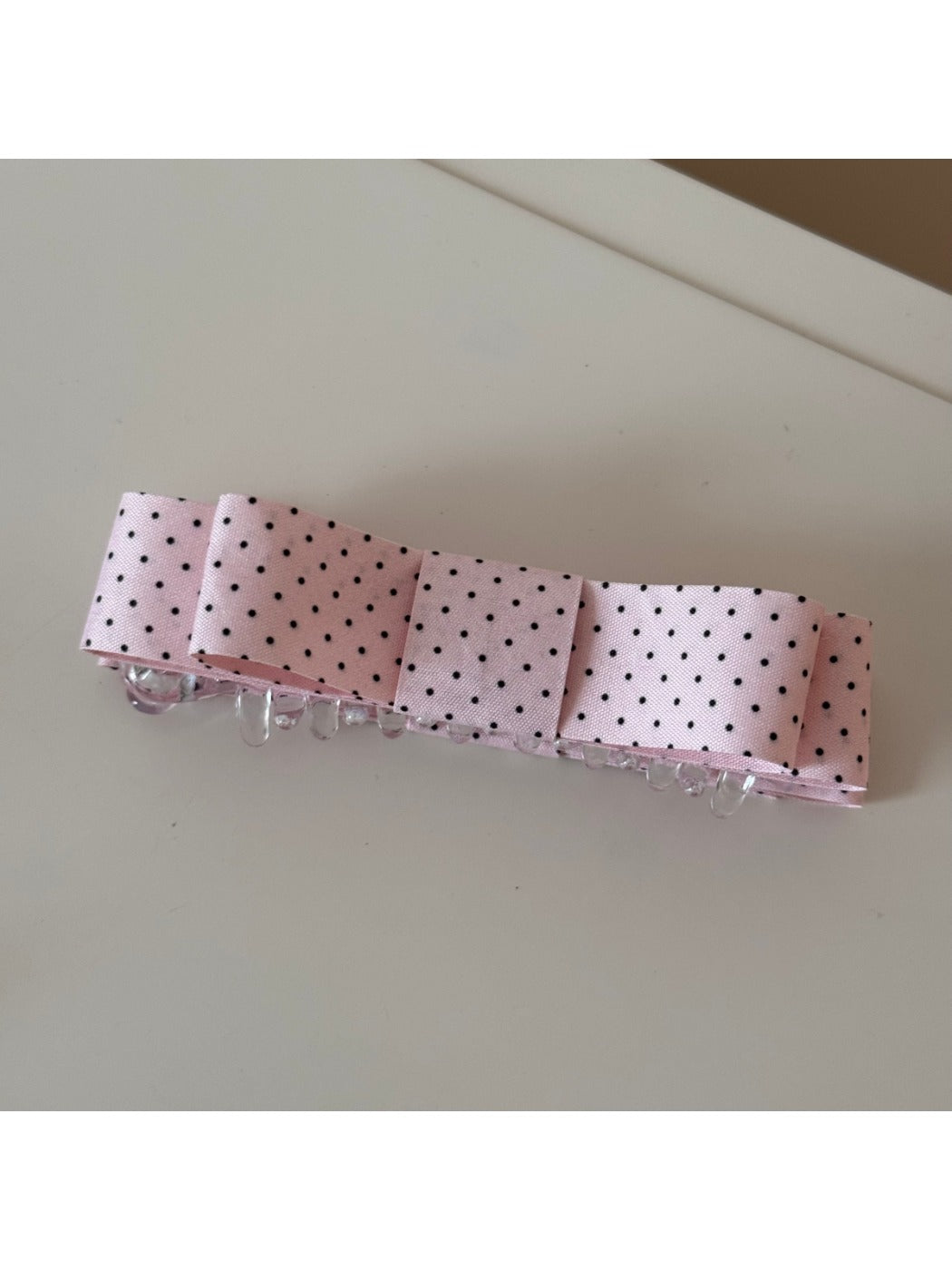 Beau hair clip styled in model's hair with pink floral design