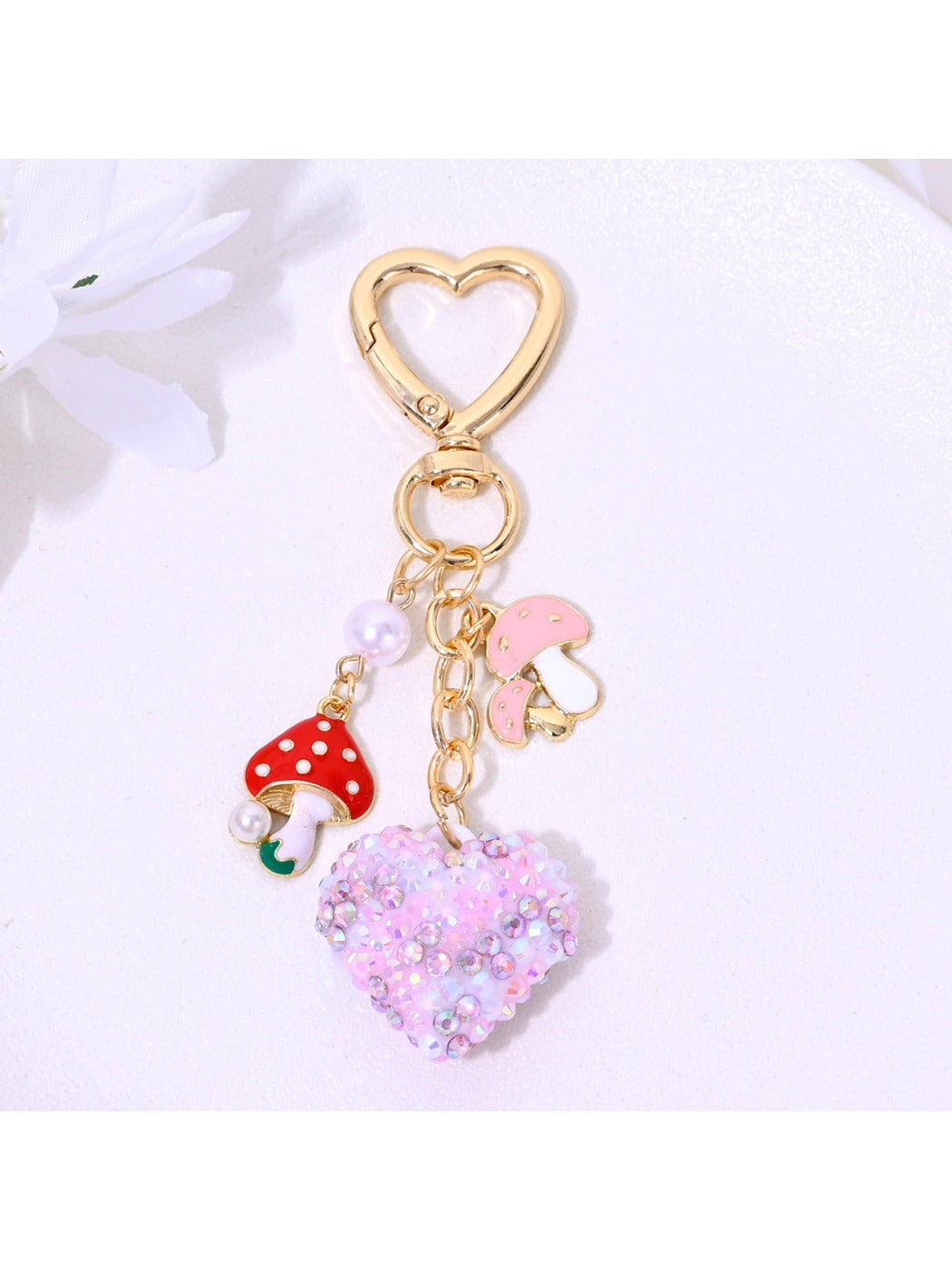 Side view of rhinestone heart keychain showing thickness and keyring attachment