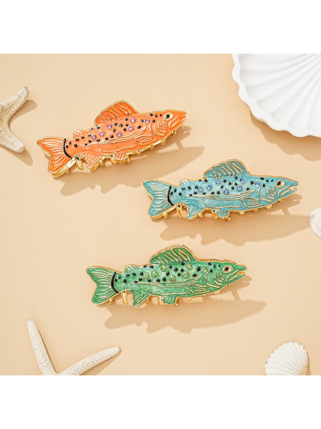 Beau personalized fish shaped hair clip with engraved name on light wood