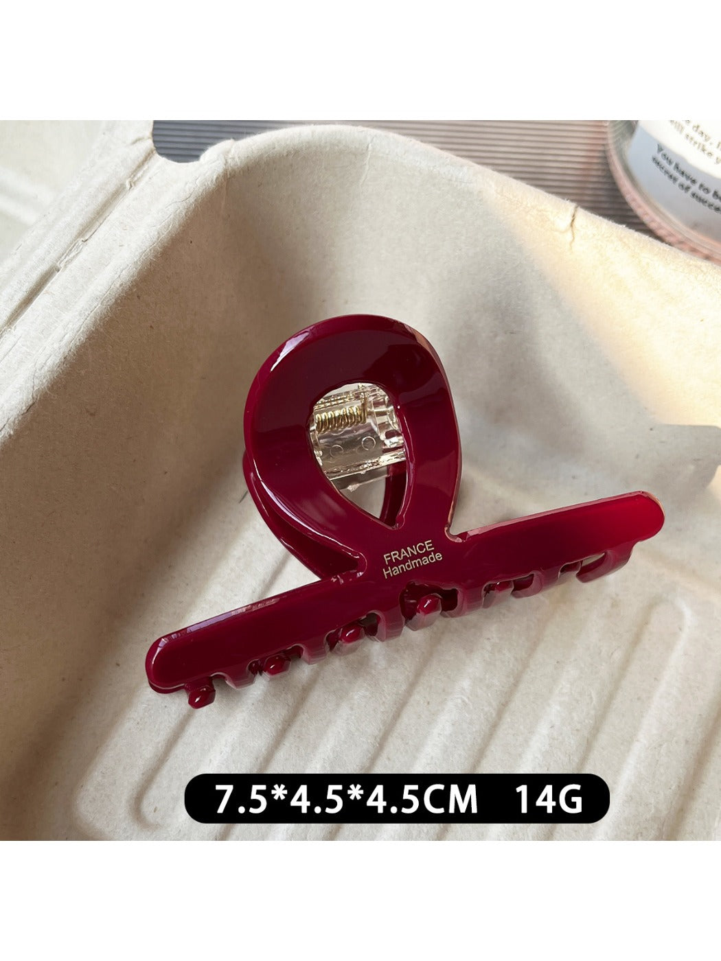 Beau claw clip displayed open to show inner teeth and clasp details