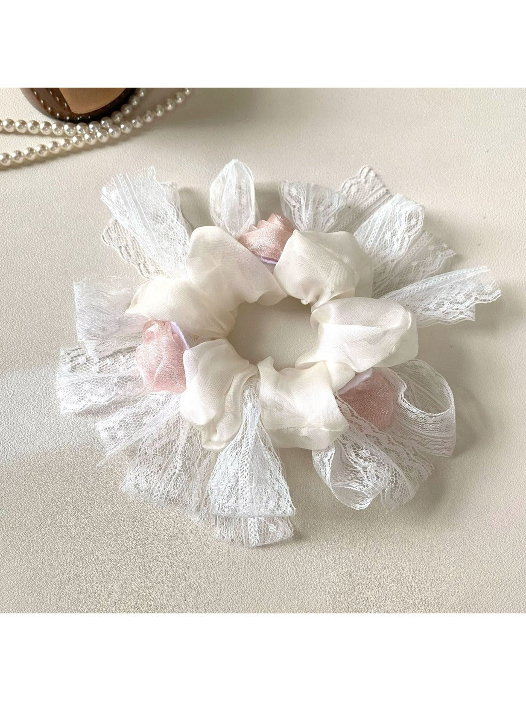 Close-up of Gifty floral scrunchie showing fabric texture and flower details
