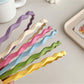 Close-up of Gifty wavy headband showing fabric texture and wave pattern
