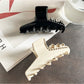 Close-up of rhinestone details on the Beau acetate claw clip