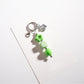 Hand holding the Keypus beaded star-shaped keychain against a blurred background