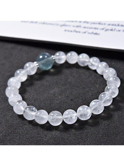 Lovra minimalist clear quartz bracelet worn on wrist with natural light