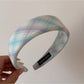 Gifty checkered bow ribbon scrunchie in natural light close-up