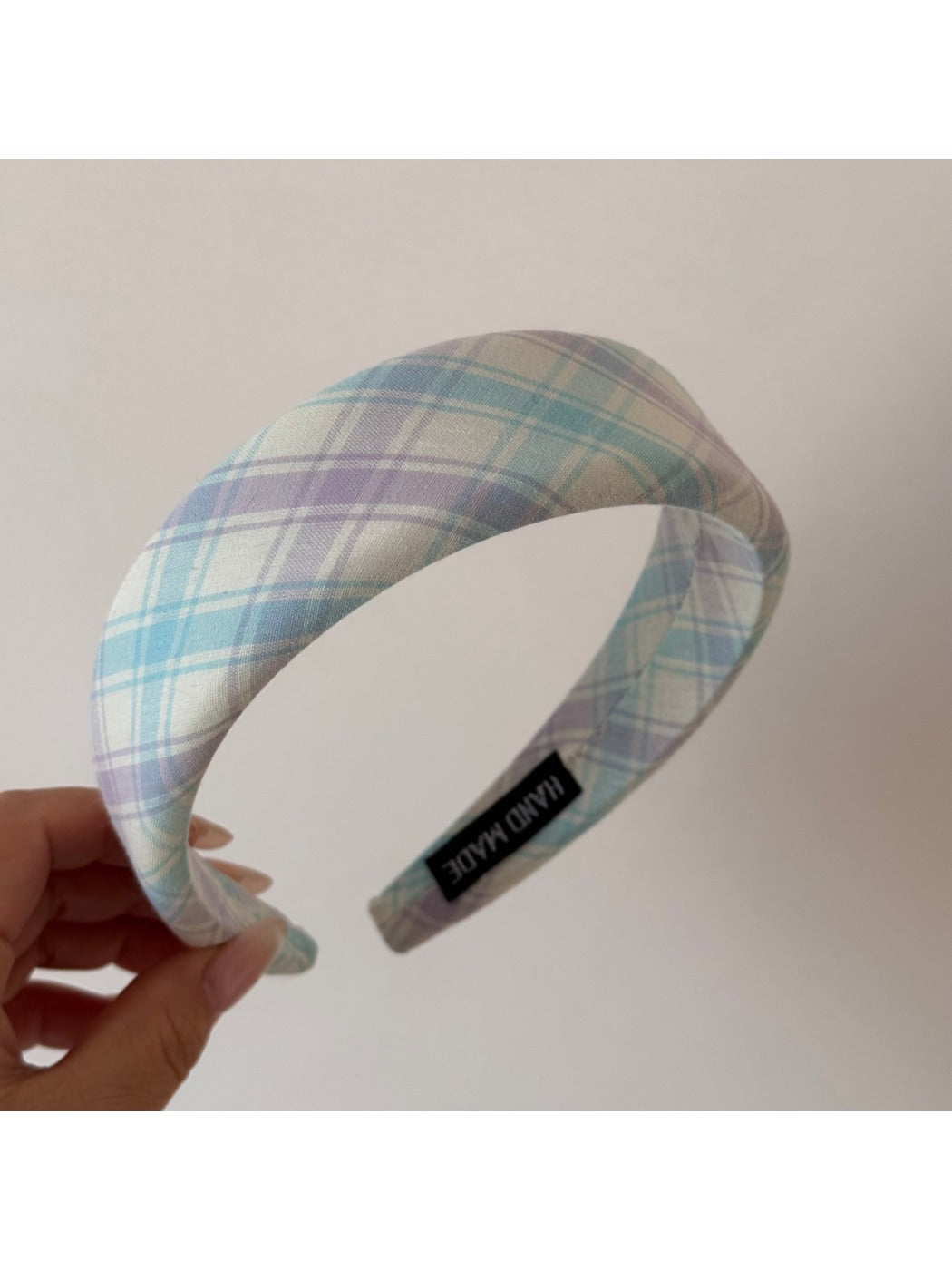 Gifty checkered bow ribbon scrunchie in natural light close-up