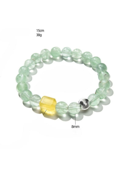 Side view of Lovra green fluorite beaded bracelet highlighting bead color variations