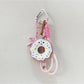Multiple donut keychains in different colors arranged in a circle