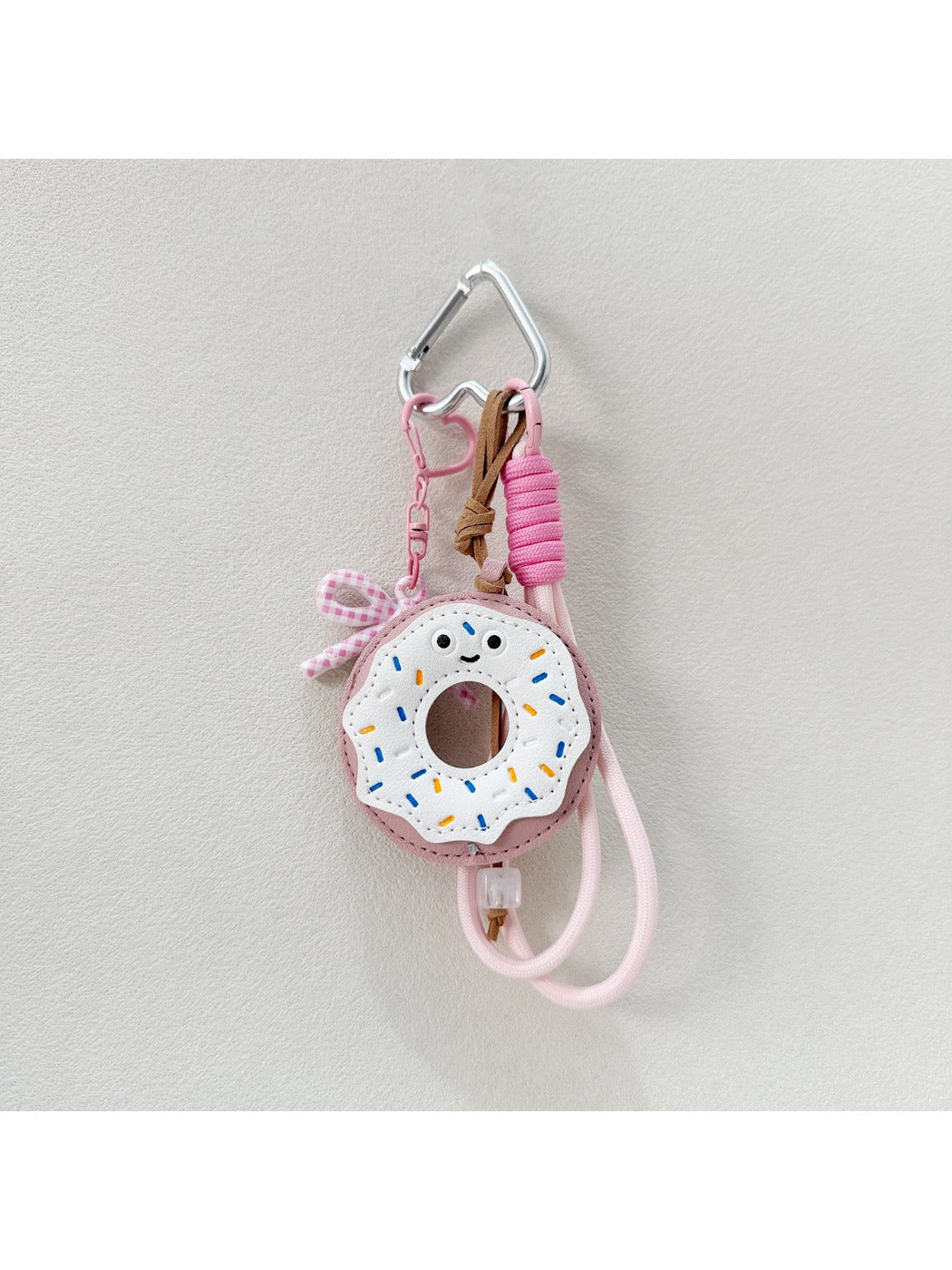 Multiple donut keychains in different colors arranged in a circle