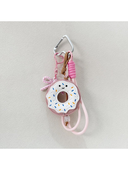 Multiple donut keychains in different colors arranged in a circle