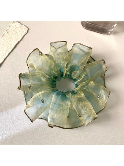 Vintage minimalist ombre hair scrunchie in soft pastel colors on a white background