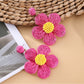 Earedge flower shaped drop earrings packaged in a branded jewelry box