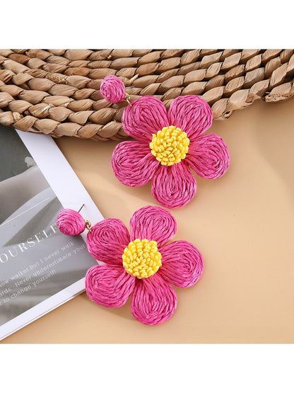 Earedge flower shaped drop earrings packaged in a branded jewelry box