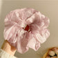 Multiple Gifty scrunchies in different pastel colors arranged together
