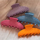 Side view of Beau polka dot hair clip highlighting clip mechanism