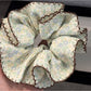 Close-up of Gifty vintage print double layer scrunchie showing fabric texture