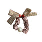 Gifty Sweet Plaid Bow Scrunchie styled on a model's hair