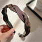Close-up of Gifty leopard print fabric and texture on the retro headband