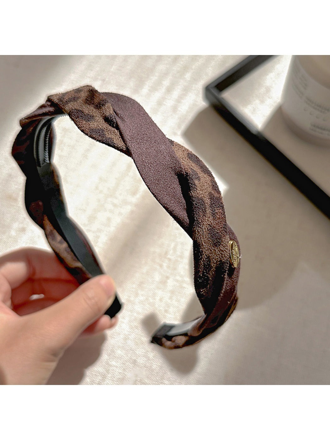 Close-up of Gifty leopard print fabric and texture on the retro headband