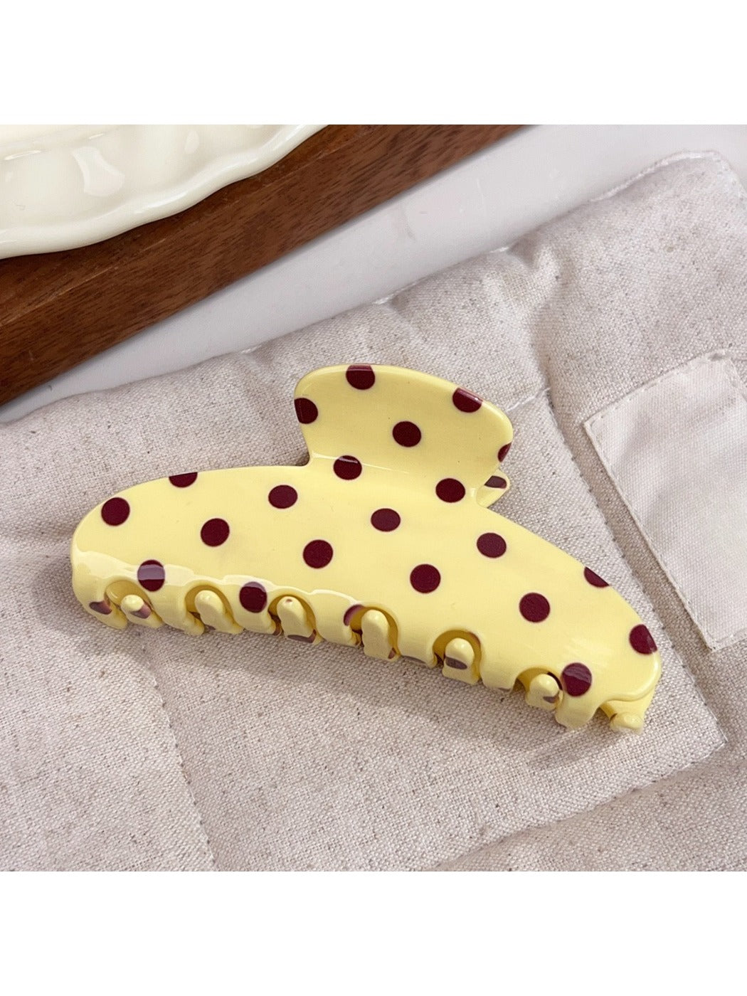 Beau polka dot half circle claw clip clipped in brown hair