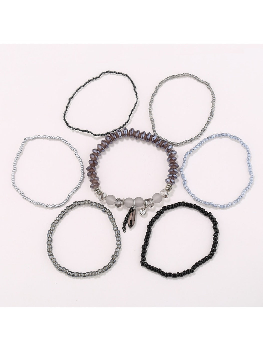 Close-up of Lovra multi-row bracelet showing detailed gold and black bead design
