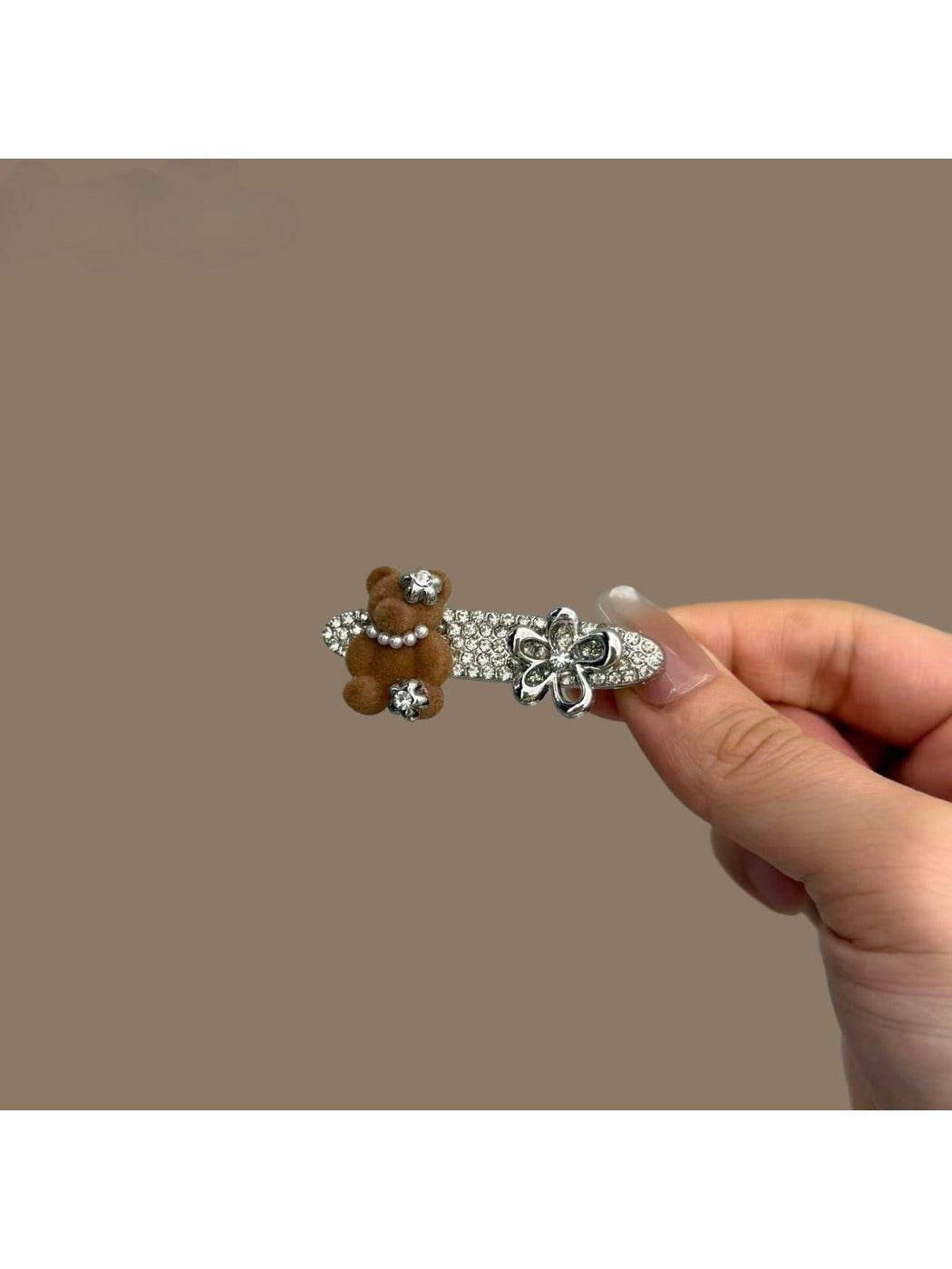 Close-up of Beau hair clip featuring a glossy bear design