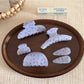 Close-up of Beau gentle blue hair clip showing smooth curved design
