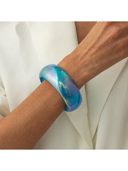 Lovra bangle bracelet stacked with other bracelets on wrist