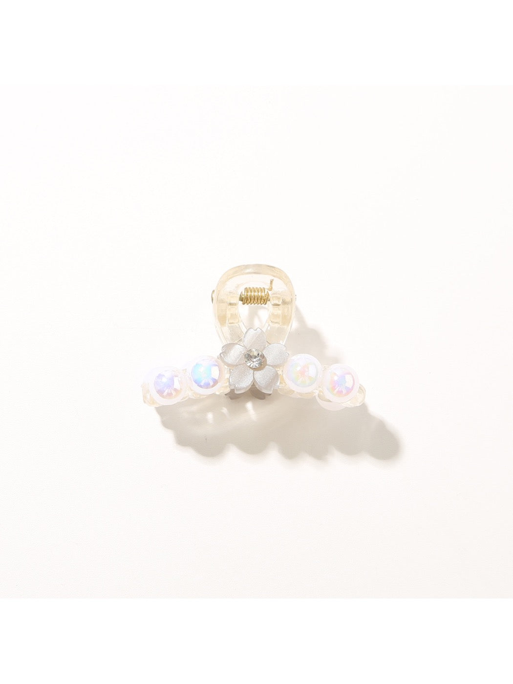 Bright multi color hair clip displayed with natural lighting