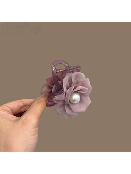Soft purple romantic hair clip with delicate fabric petals and a metal clasp