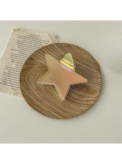 Beau star shaped claw clip partially open, showing claw curvature
