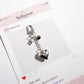 Keypus bag charm keychain displayed alongside other accessories