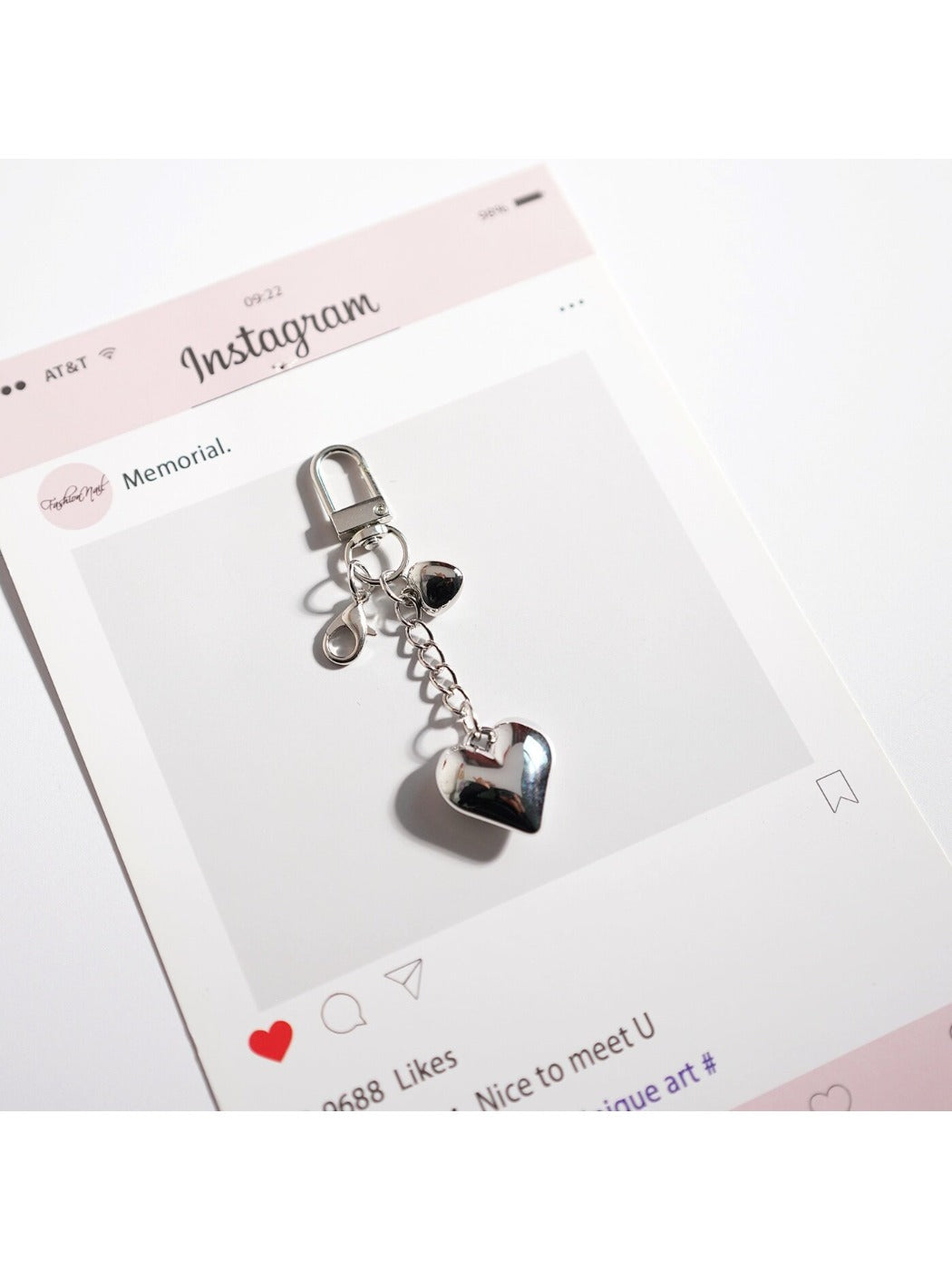 Keypus bag charm keychain displayed alongside other accessories