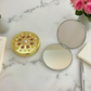 Round compact mirror, product display