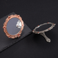 Ornate hand mirror, open and closed views