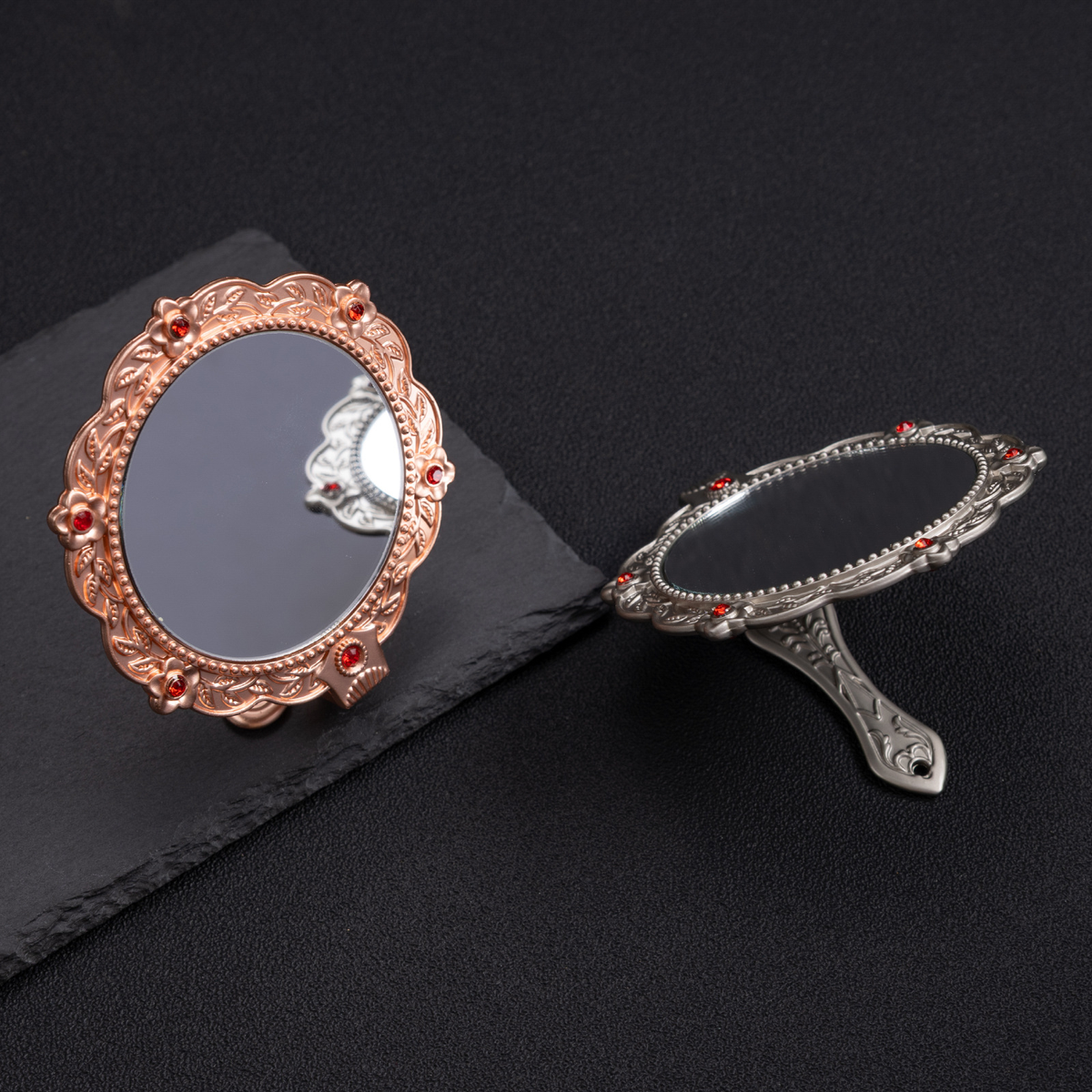 Ornate hand mirror, open and closed views