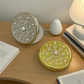 Round compact mirror, open and closed views