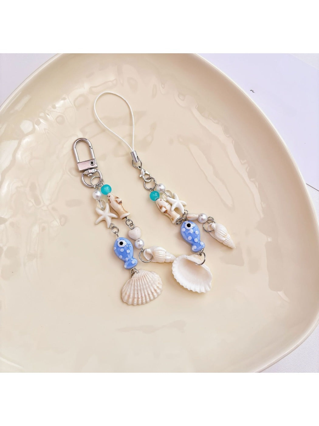 Close-up of blue fish keychain showing detailed fins and eye