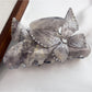 Beau colorful butterfly hair claw clip photographed with soft shadows