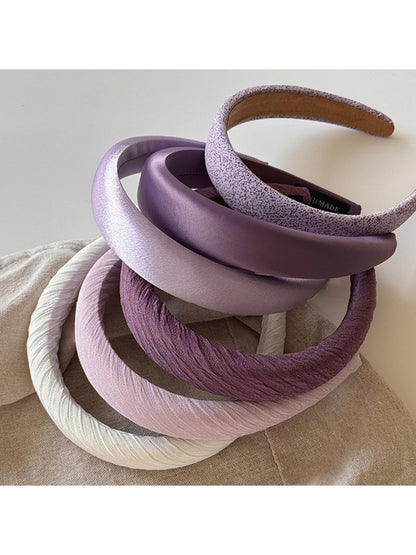 Purple wide edge headband displayed on a white background