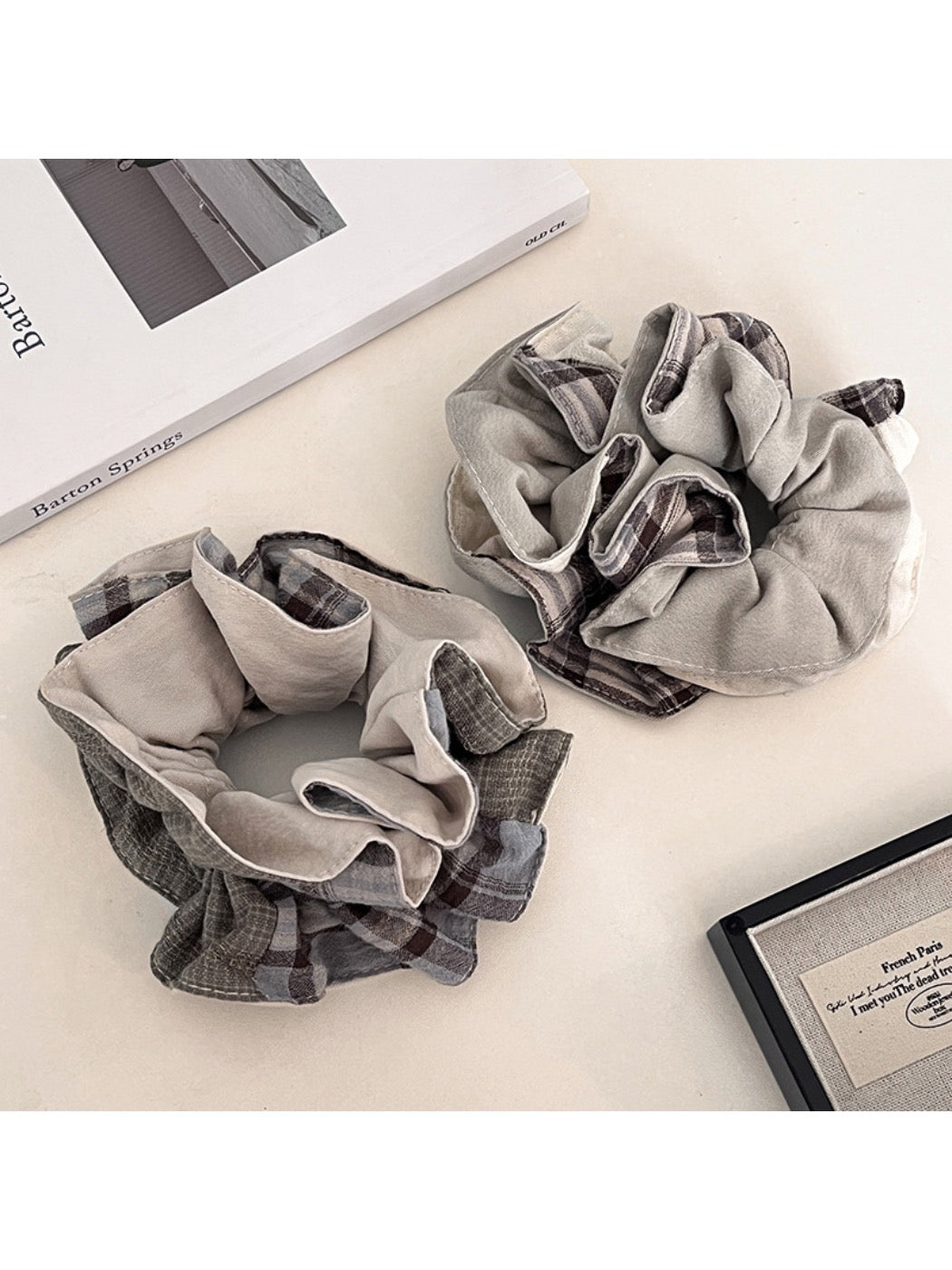Close-up of Gifty polished neat look scrunchie in soft beige fabric
