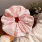 Multiple Gifty Lazy Style textured scrunchies stacked together