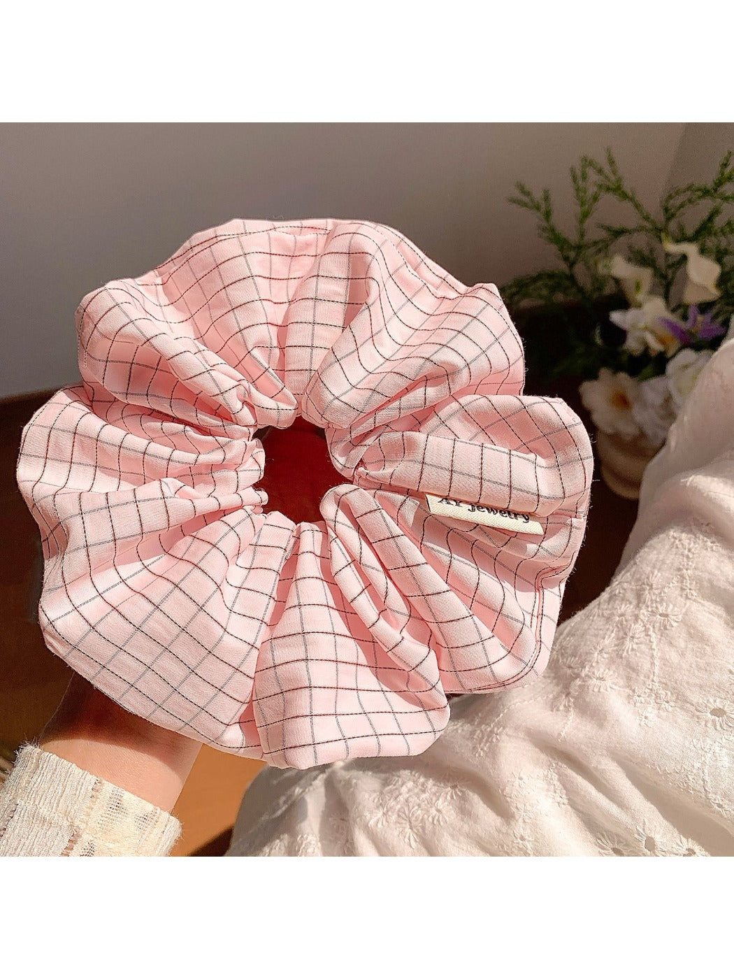 Multiple Gifty Lazy Style textured scrunchies stacked together