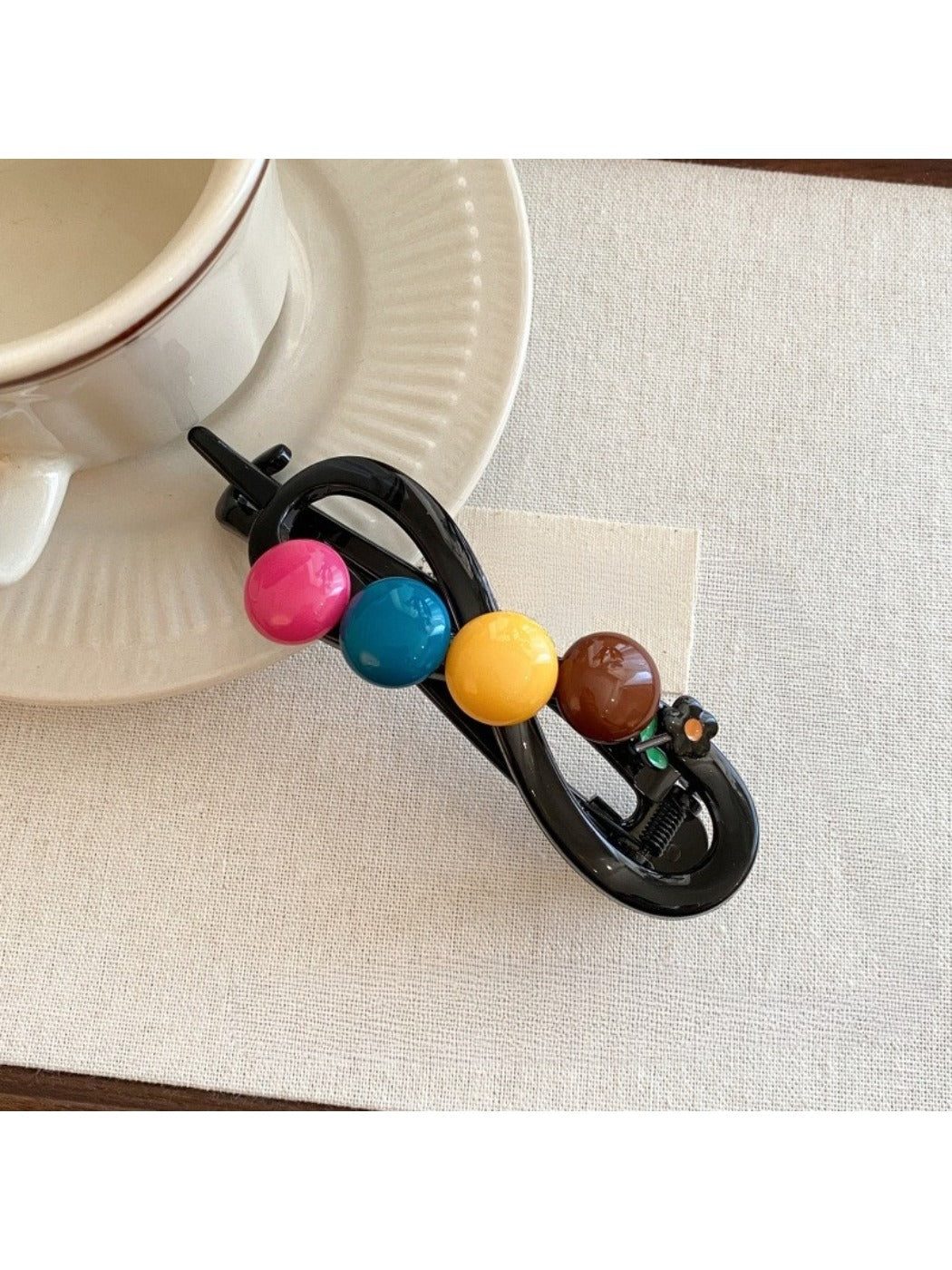 Side view of Beau colorful round bead bar hair clip in styled hair