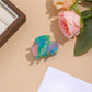 Beau vibrant acetate hair clip with vibrant color variations in acetate material