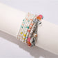 Lovra alloy pendant beaded bracelet coiled to display full design and bead pattern