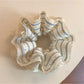 Close-up of Gifty modern minimalist striped scrunchie in neutral tones on white background