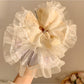 Close-up of Gifty Ditsy Floral Lace Trim Scrunchie with pink and white floral pattern