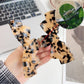 Side view of Beau bow shaped hair claw clip in beige